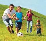 Photograph of family playing football